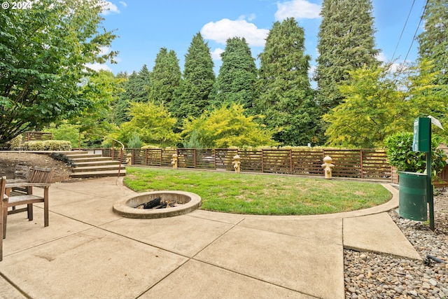 view of patio / terrace with an outdoor fire pit