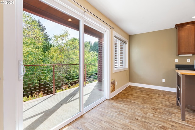 unfurnished dining area featuring light hardwood / wood-style floors