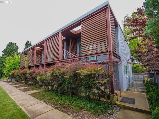 view of side of property with a balcony