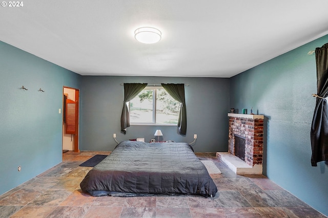 bedroom with a brick fireplace