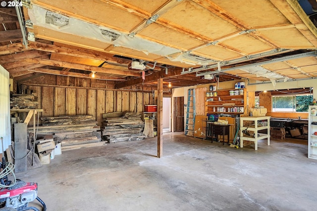 interior space featuring a garage door opener and a workshop area