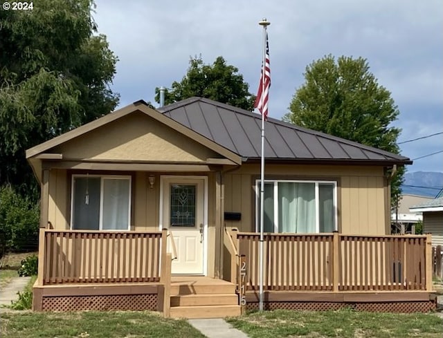 view of front of house featuring metal roof and a standing seam roof