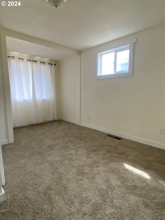 view of carpeted spare room