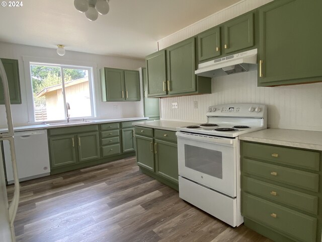 kitchen with dark hardwood / wood-style floors, sink, white appliances, and green cabinetry