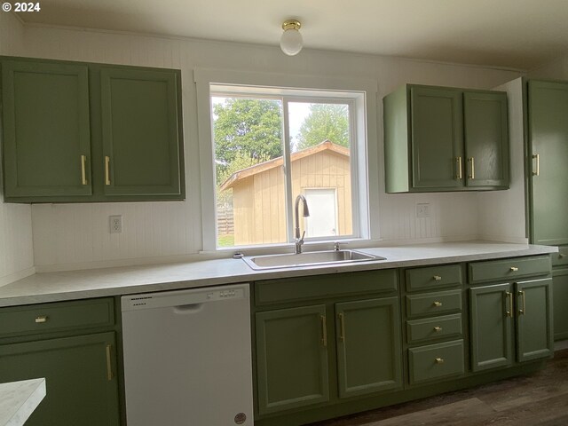 kitchen featuring sink, green cabinets, and dishwasher