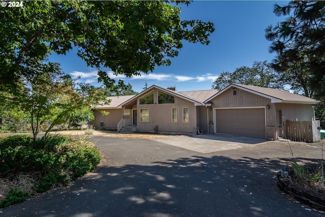 single story home with a garage