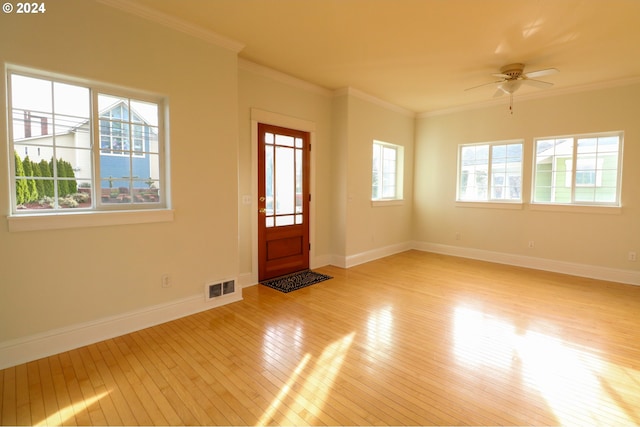 entryway featuring ceiling fan, light hardwood / wood-style floors, and ornamental molding