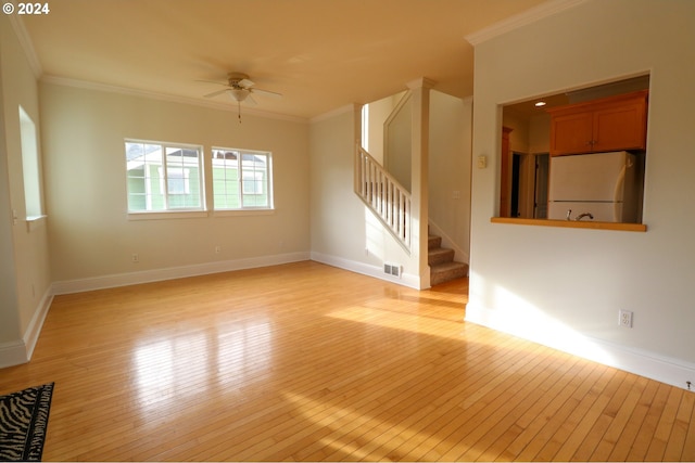 unfurnished room with light hardwood / wood-style flooring, ceiling fan, and ornamental molding