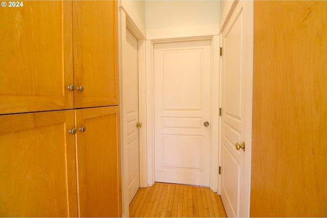 hall with light wood-type flooring