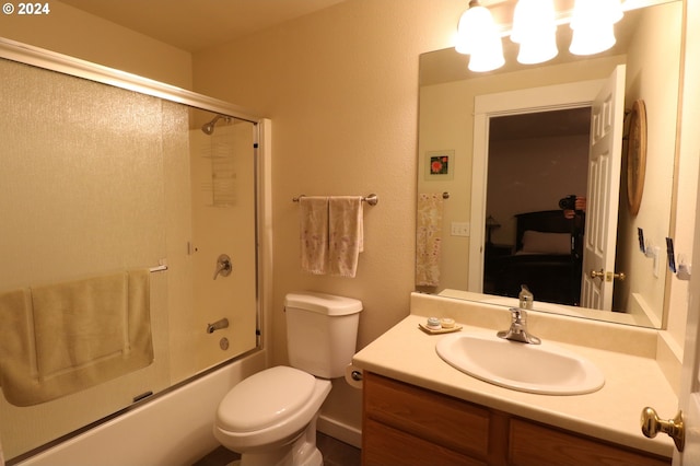 full bathroom featuring vanity, toilet, and combined bath / shower with glass door