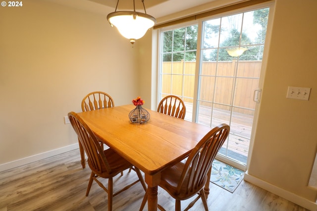 dining area with wood-type flooring