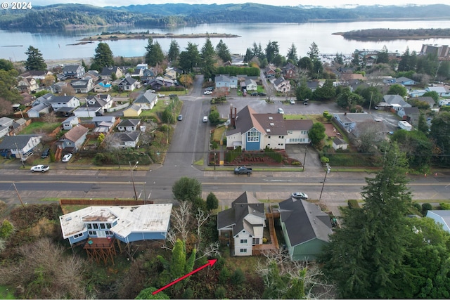 birds eye view of property with a water view