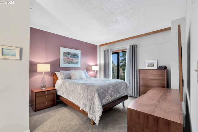 carpeted bedroom with a textured ceiling