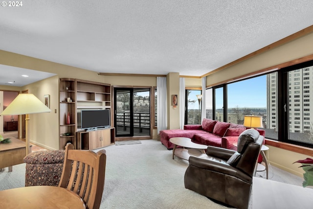 living room featuring carpet flooring, a textured ceiling, a wealth of natural light, and crown molding