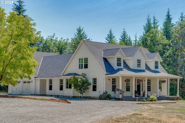 view of front of house with a porch and a garage