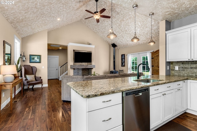 kitchen featuring dark hardwood / wood-style floors, sink, white cabinetry, ceiling fan, and stainless steel dishwasher