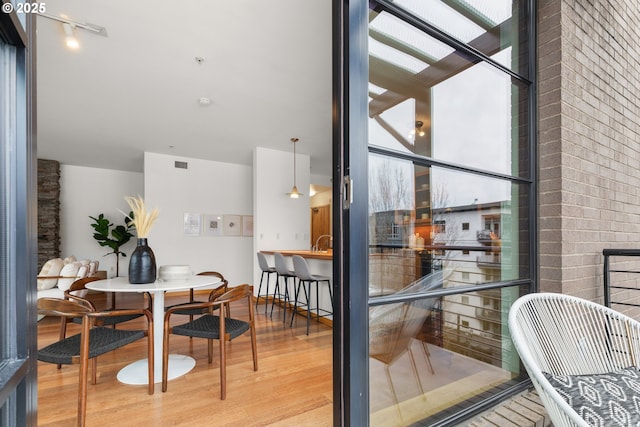 dining area with wood-type flooring