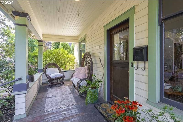 wooden deck featuring covered porch