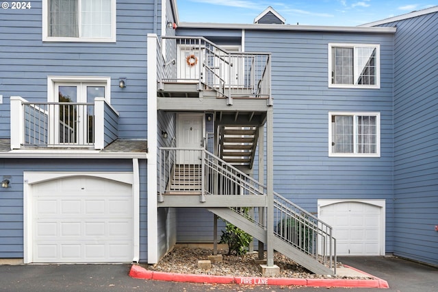 view of front of home with a balcony and a garage