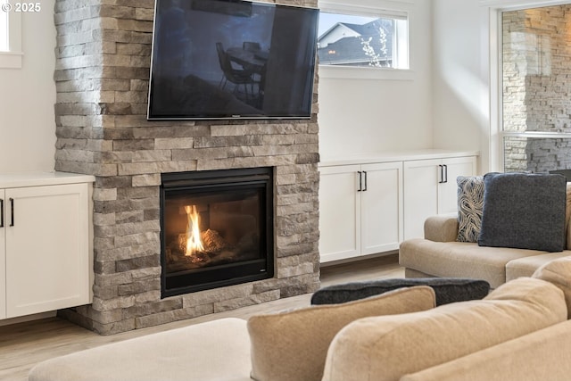 4116 S 16th Way, Ridgefield, WA 98642 - living room featuring a glass covered fireplace and wood finished floors