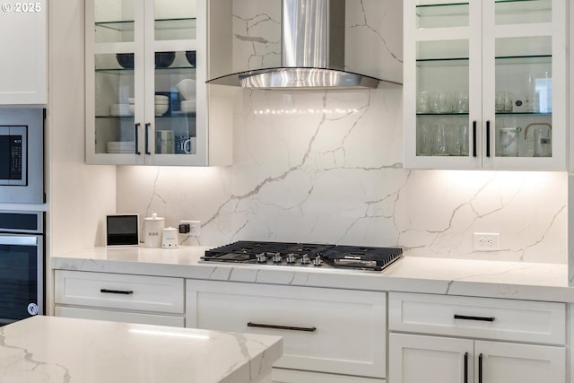 4116 S 16th Way, Ridgefield, WA 98642 - kitchen with wall chimney exhaust hood, stainless steel appliances, backsplash, white cabinets, and glass insert cabinets
