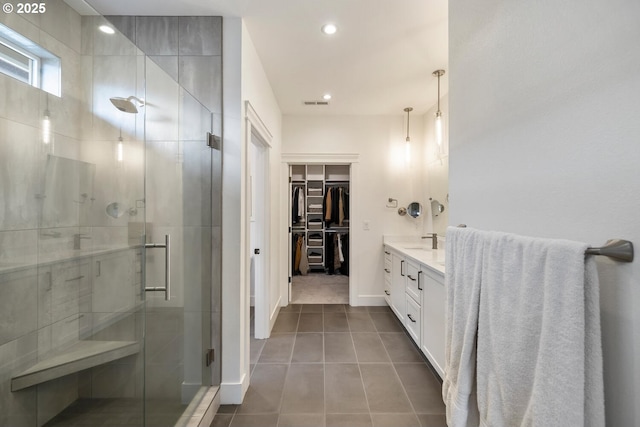 4116 S 16th Way, Ridgefield, WA 98642 - full bath featuring a stall shower, vanity, tile patterned floors, a spacious closet, and recessed lighting