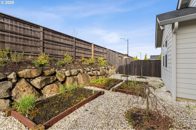 4116 S 16th Way, Ridgefield, WA 98642 - fenced backyard with a vegetable garden