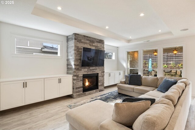 4116 S 16th Way, Ridgefield, WA 98642 - living room with a fireplace, a tray ceiling, healthy amount of natural light, and recessed lighting