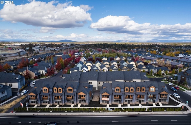 birds eye view of property featuring a mountain view