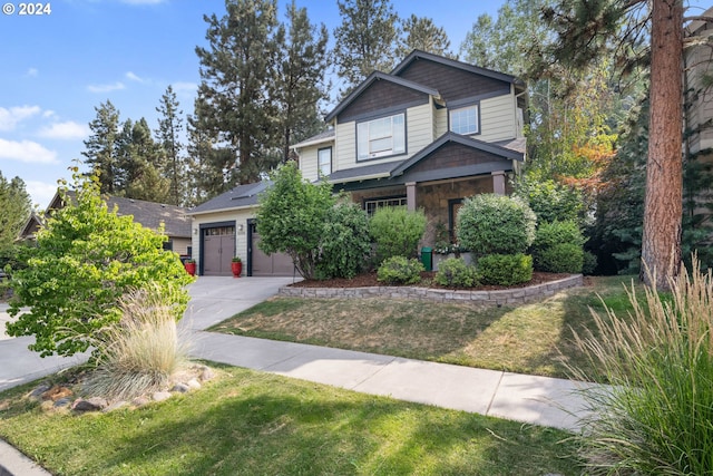 craftsman-style home with a front lawn and a garage