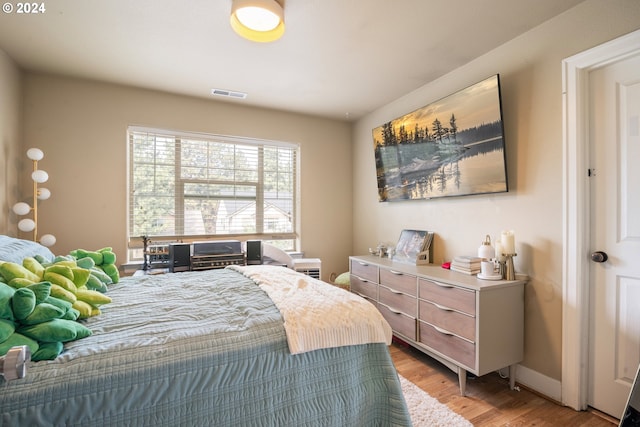 bedroom with light wood-type flooring