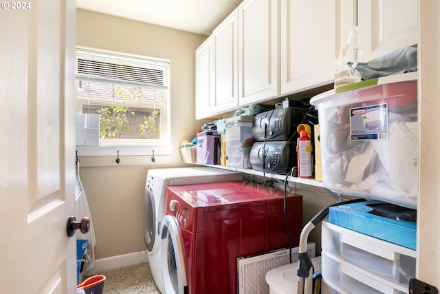 washroom with cabinets and separate washer and dryer