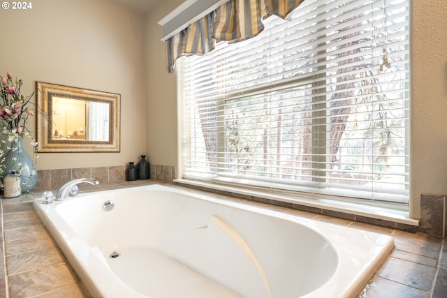 bathroom featuring tiled bath