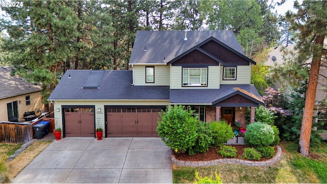 craftsman inspired home with a garage