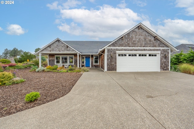 402 Diamond Ln, Gearhart, OR 97138 - single story home featuring concrete driveway, an attached garage, a shingled roof, and a porch