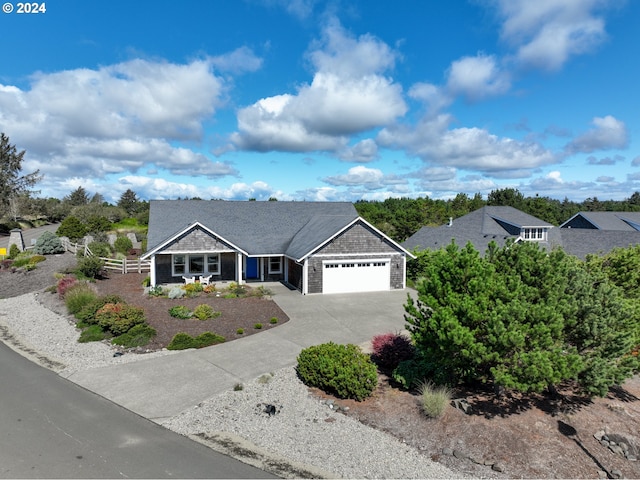 402 Diamond Ln, Gearhart, OR 97138 - single story home featuring covered porch, fence, an attached garage, and driveway