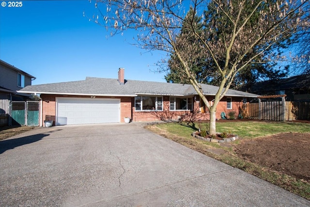 ranch-style house with a garage and a front yard