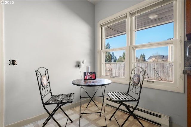 dining area featuring a baseboard heating unit