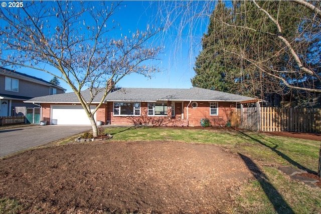 single story home with a garage and a front yard