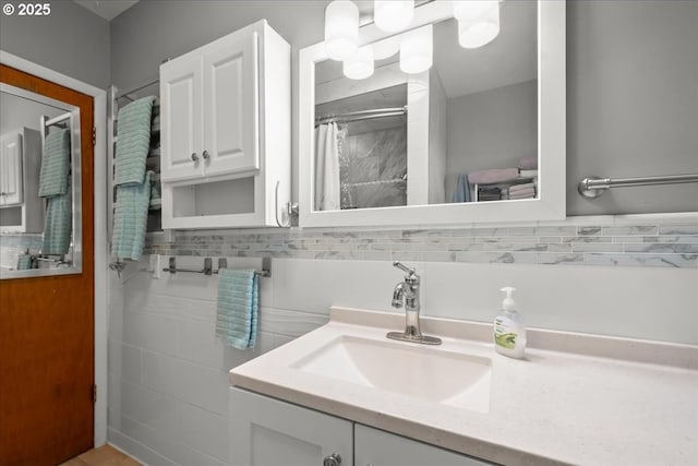 bathroom featuring vanity, tile walls, and a shower with shower curtain