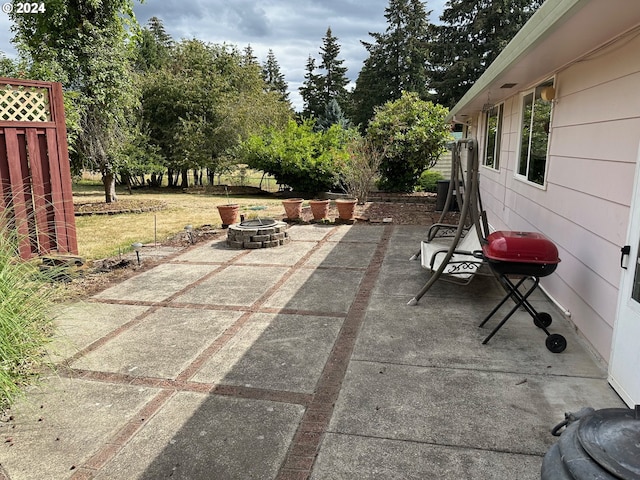 view of patio / terrace with grilling area and an outdoor fire pit