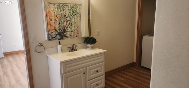 bathroom with vanity, hardwood / wood-style floors, and toilet