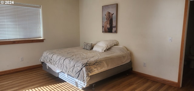 bedroom featuring dark wood-type flooring