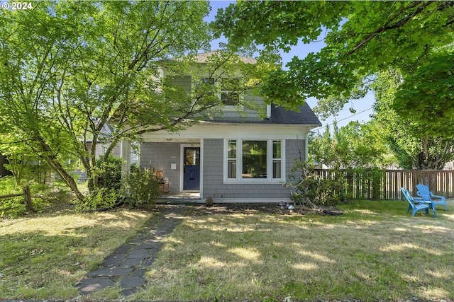 view of front of property with a front lawn