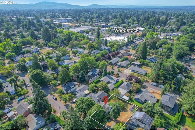 birds eye view of property with a mountain view