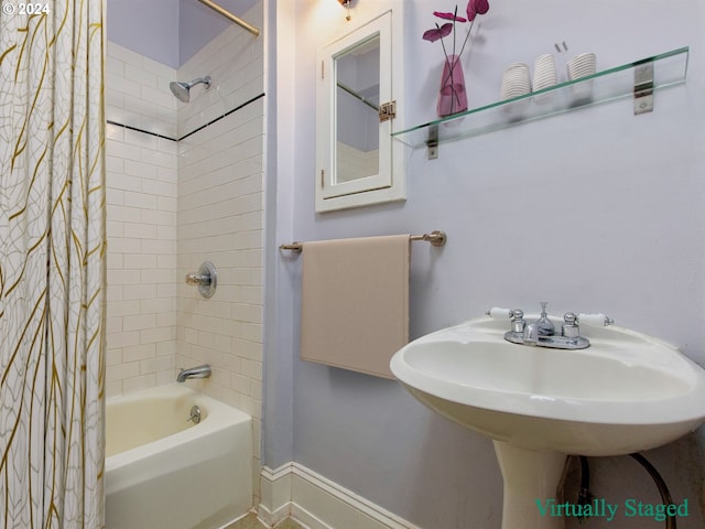 bathroom featuring shower / tub combo with curtain