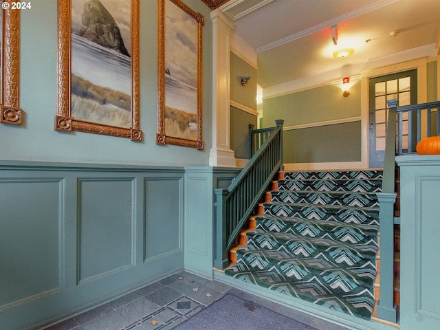 interior space featuring dark carpet and crown molding