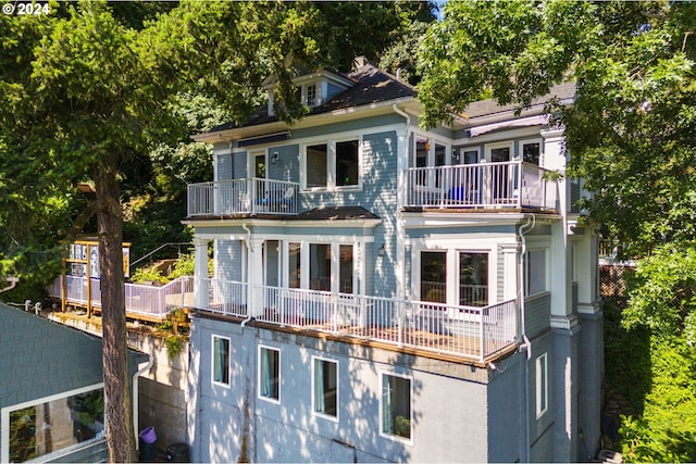 back of house with a balcony