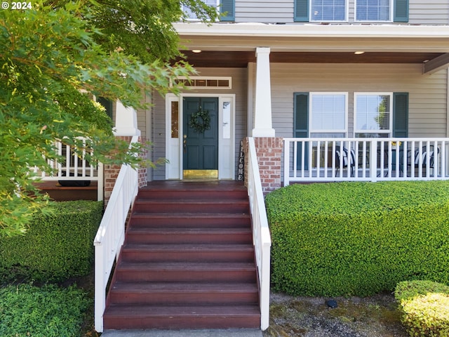 property entrance with covered porch