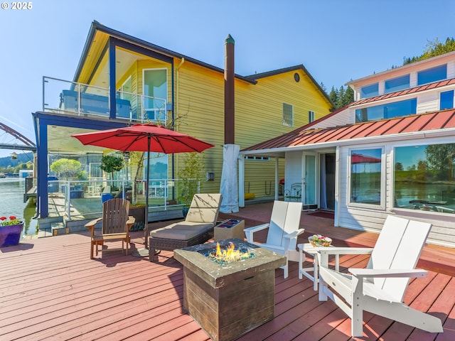 14581 NW Larson Rd Unit 7, Portland, OR 97231 - wooden deck with a water view and an outdoor fire pit